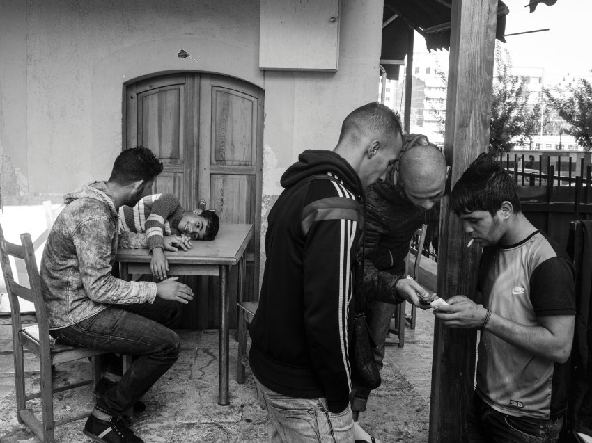 Izmir, Trukey. October 2, 2015.Syrian refugees hoping to make the journey to Europe gather in the courtyard of a mosque in the Basmane district of Izmir, Turkey, a place where refugees are able to meet smugglers in order to arrange the journey to Greece.(Photo by Moises Saman/MAGNUM)