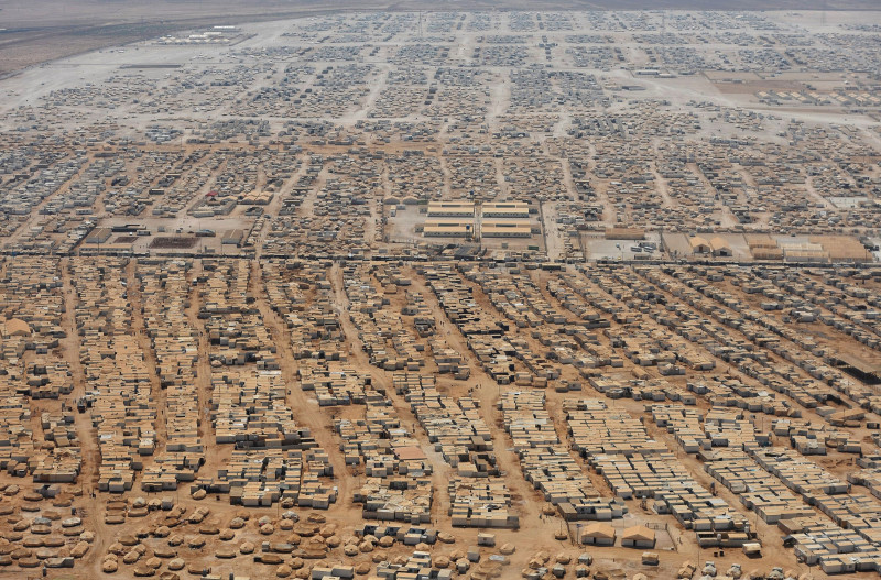 An aerial view shows the Zaatari refugee camp, near the Jordanian city of Mafraq July 18, 2013. U.S. Secretary of State John Kerry spent about 40 minutes with half a dozen refugees who vented their frustration at the international community's failure to end Syria's more than two-year-old civil war, while visiting the camp that holds roughly 115,000 Syrian refugees in Jordan about 12 km (eight miles) from the Syrian border. REUTERS/Mandel Ngan/Pool (JORDAN - Tags: POLITICS SOCIETY IMMIGRATION TPX IMAGES OF THE DAY) - RTX11QHF